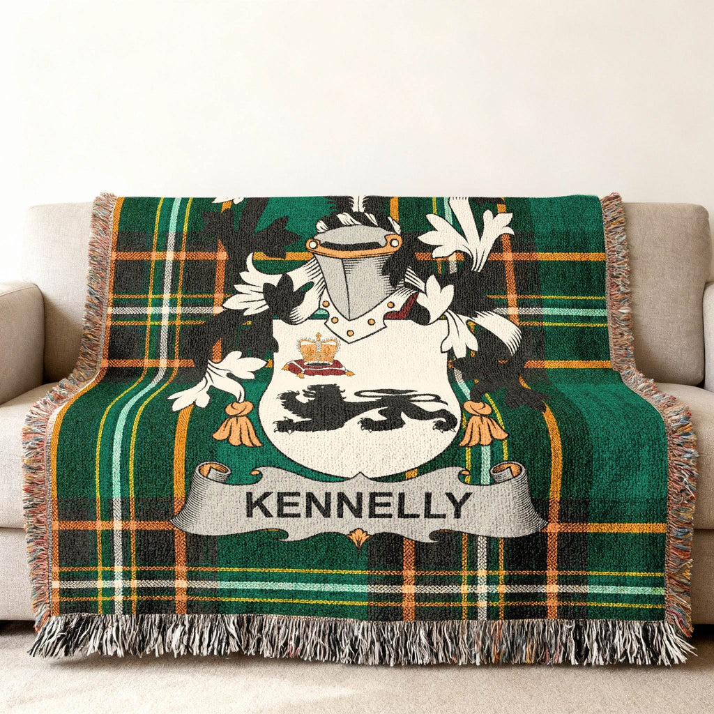 Kenneally family crest on green and black plaid throw blanket on couch.