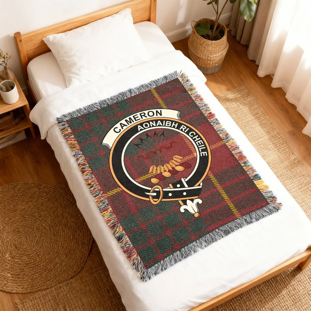 Cameron Aonaibh Ri Chéile tartan woven blanket folded — red plaid weave with clan crest