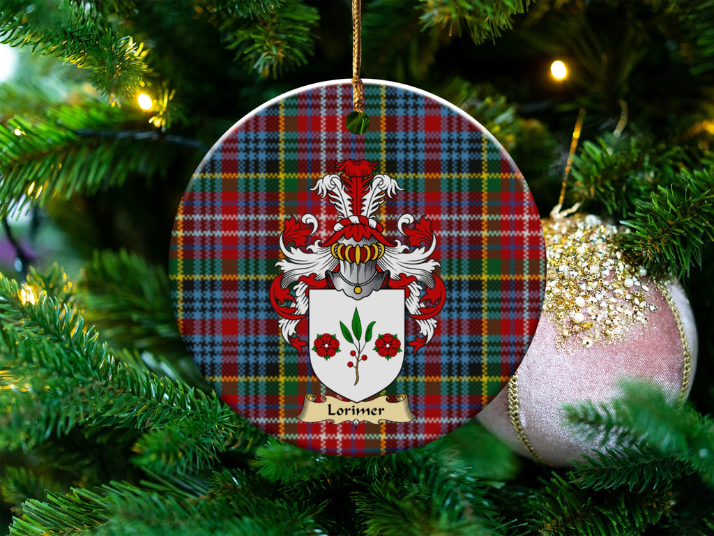 Lorimer Scottish clan ceramic ornament with family crest on a Caledonia tartan background, hanging on a Christmas tree