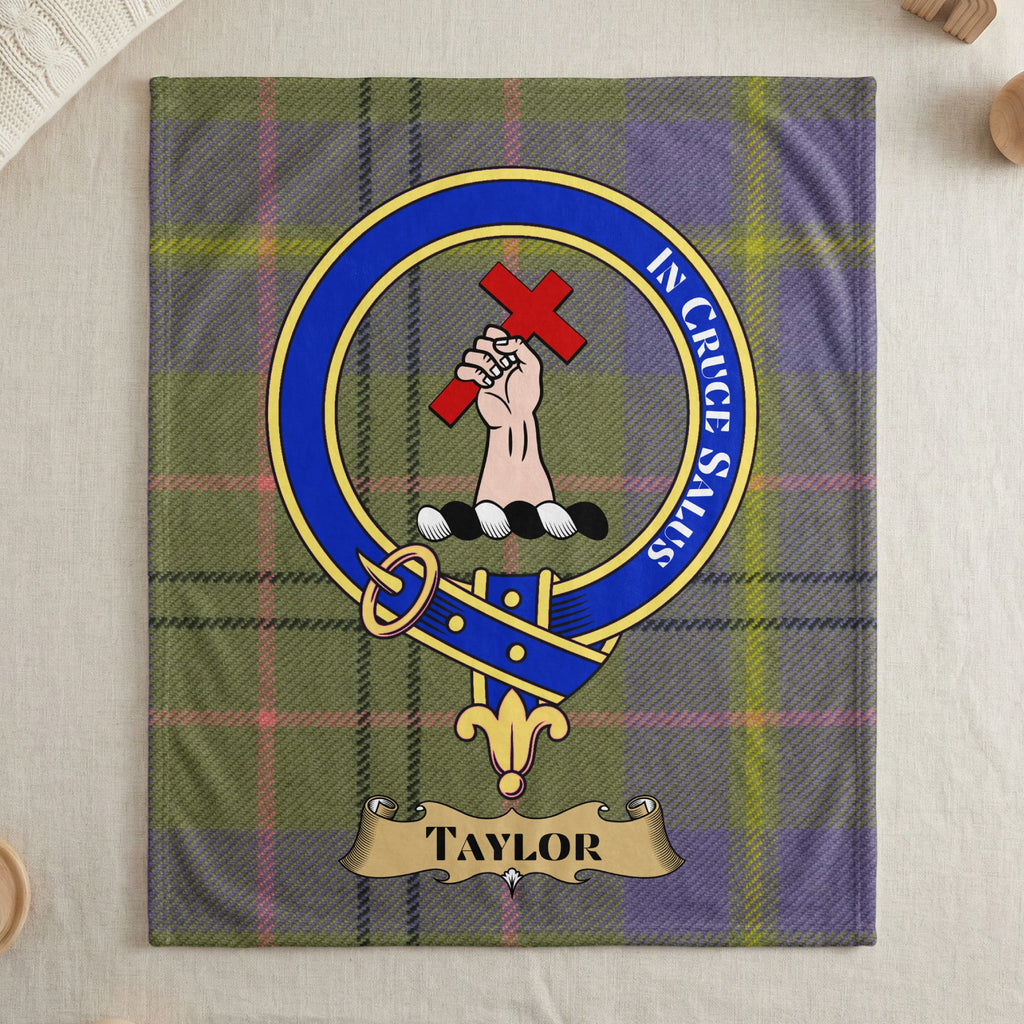 Taylor clan crest and motto on tartan throw blanket — draped display