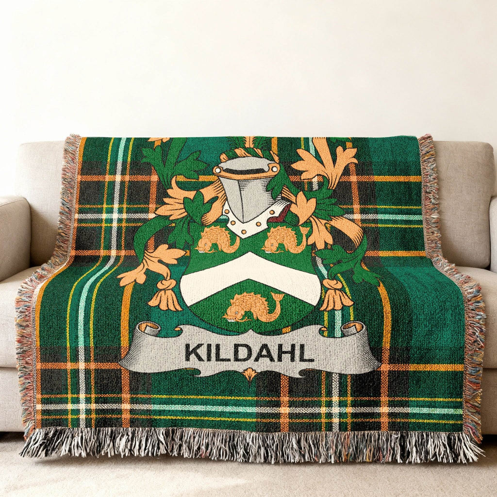 Green tartan throw blanket with Kildahl family crest.