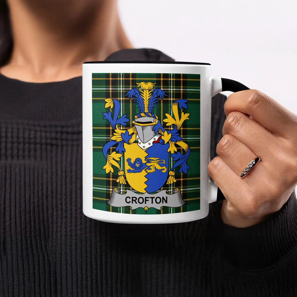 Mug with Crofton family crest on green plaid background.