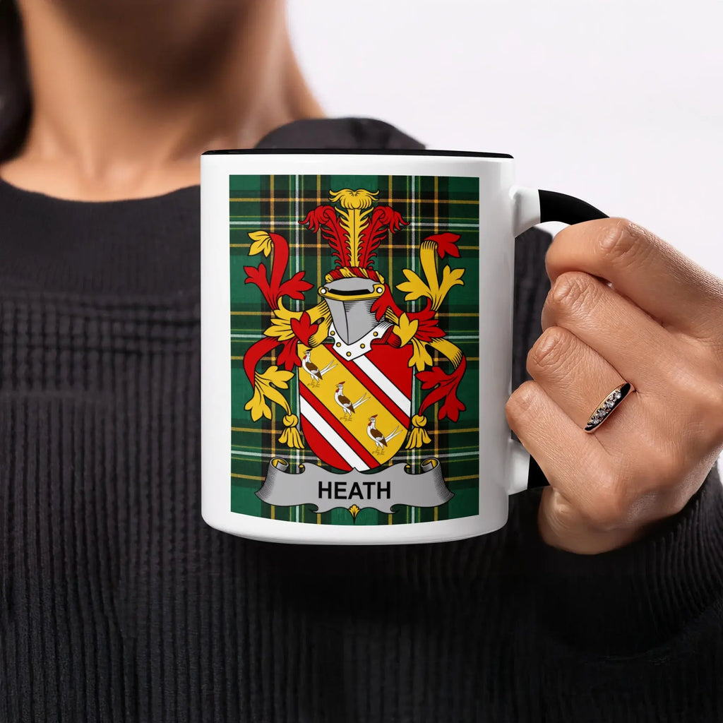 Mug with Heath family crest on plaid background.