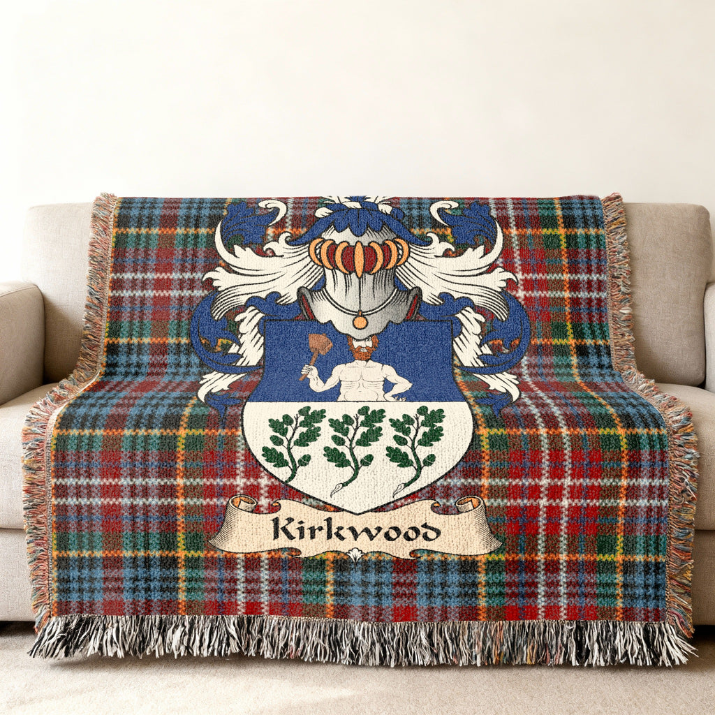 Kirkwood family crest emblem on a Caledonia tartan woven blanket