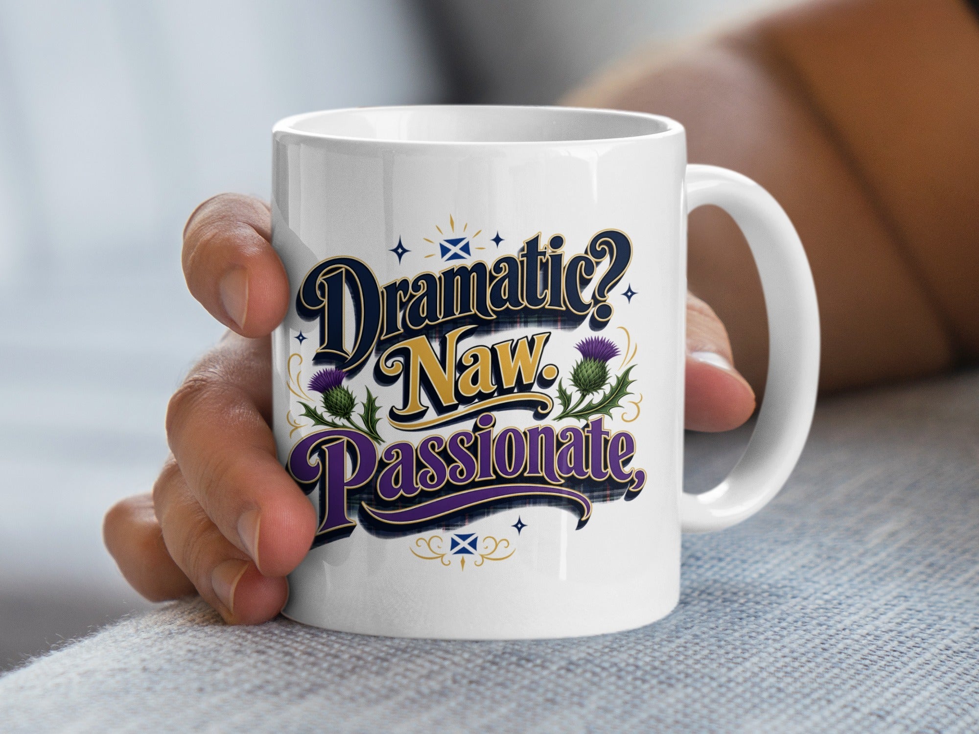 White mug with "Dramatic? Naw. Passionate." text and thistle designs.