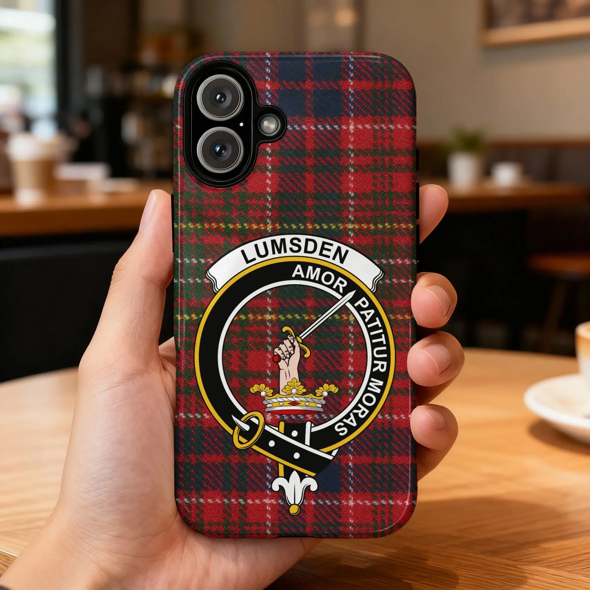 Clan Lumsden crest phone case — iPhone fit shown, edge-to-edge red tartan print with precise port cutouts
