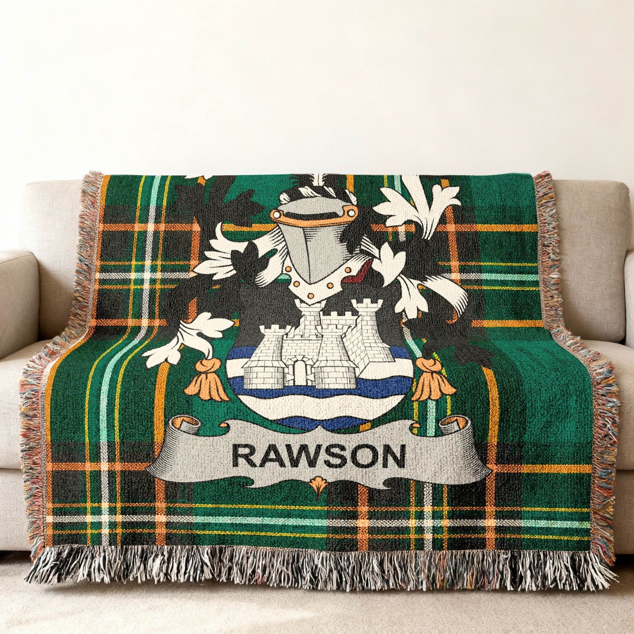 Green plaid throw blanket featuring the Rawson family crest with a castle and shield.