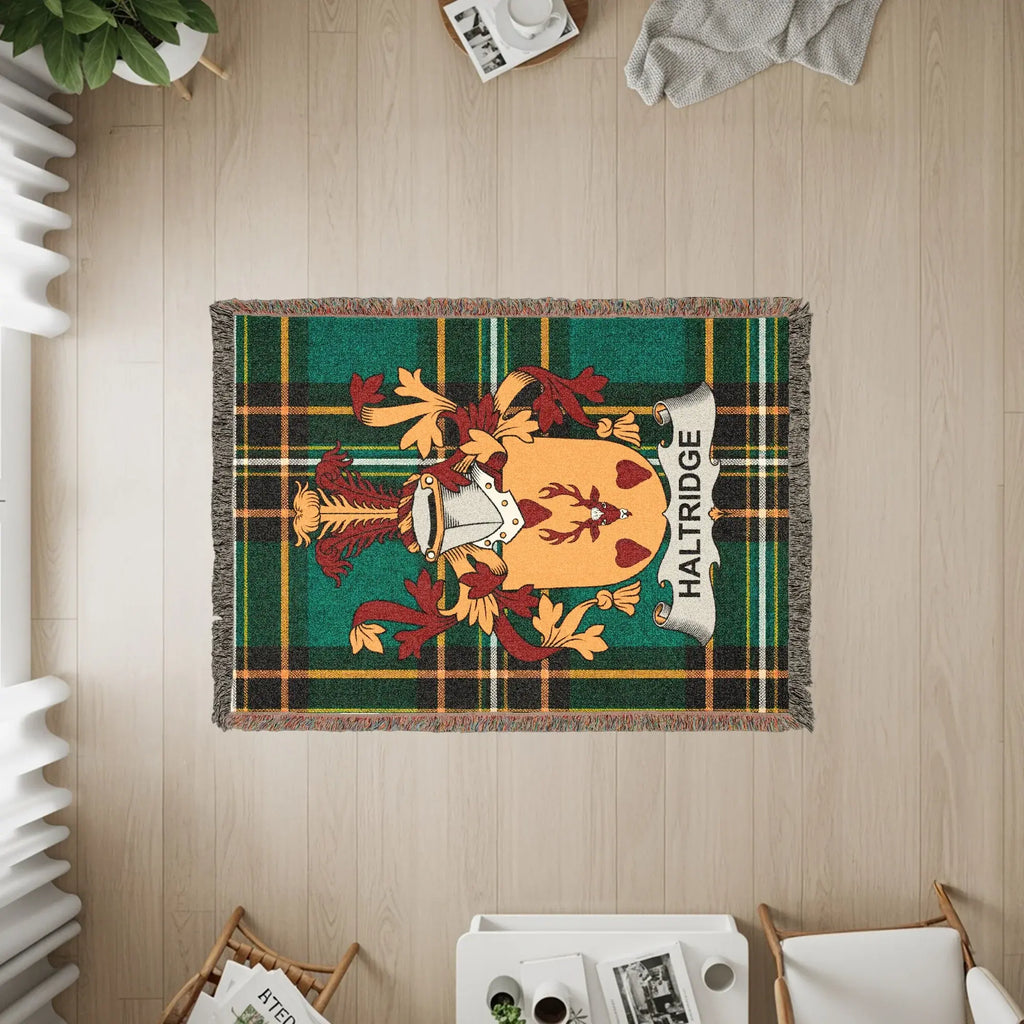 Haldridge family crest on a tartan plaid woven throw blanket.