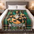 Tartan blanket featuring a coat of arms with "MCGOUGH" banner.