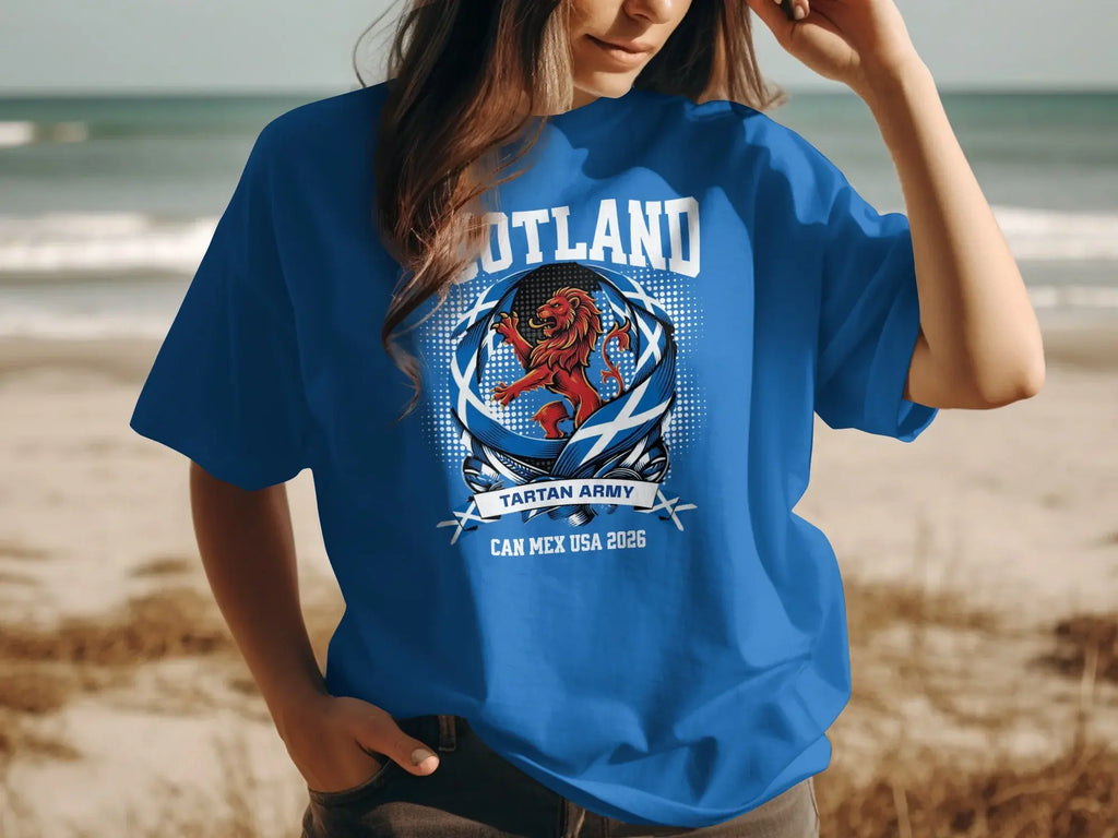 Blue t-shirt with Scotland tartan army lion and CAN MEX USA 2026 text.