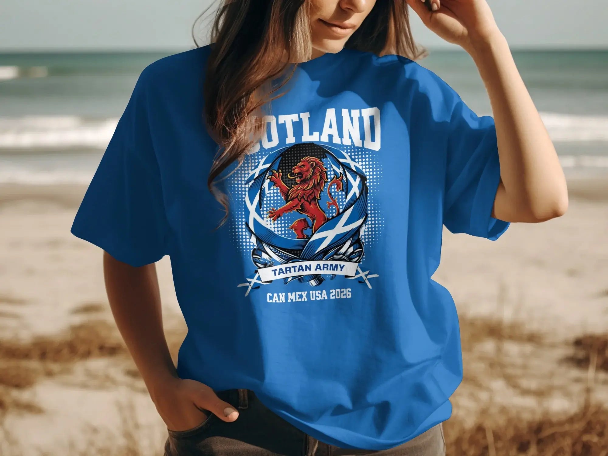 Blue t-shirt with Scotland tartan army lion and CAN MEX USA 2026 text.