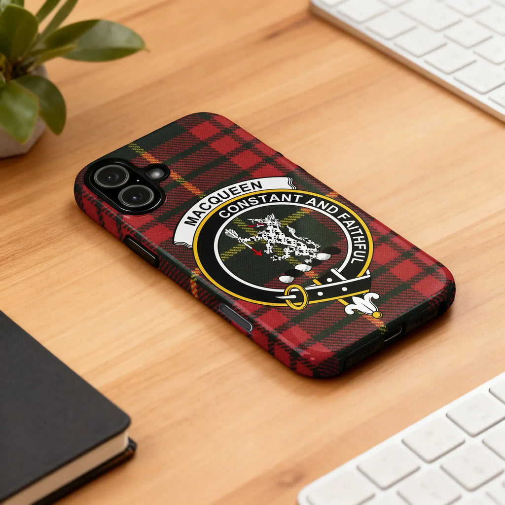 MacQueen clan crest tartan case on iPhone — edge-to-edge plaid print, slim glossy profile