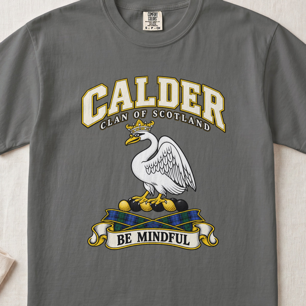 Calder Scottish clan T-shirt in Pepper, front view with a white swan wearing a gold crown and motto banner.