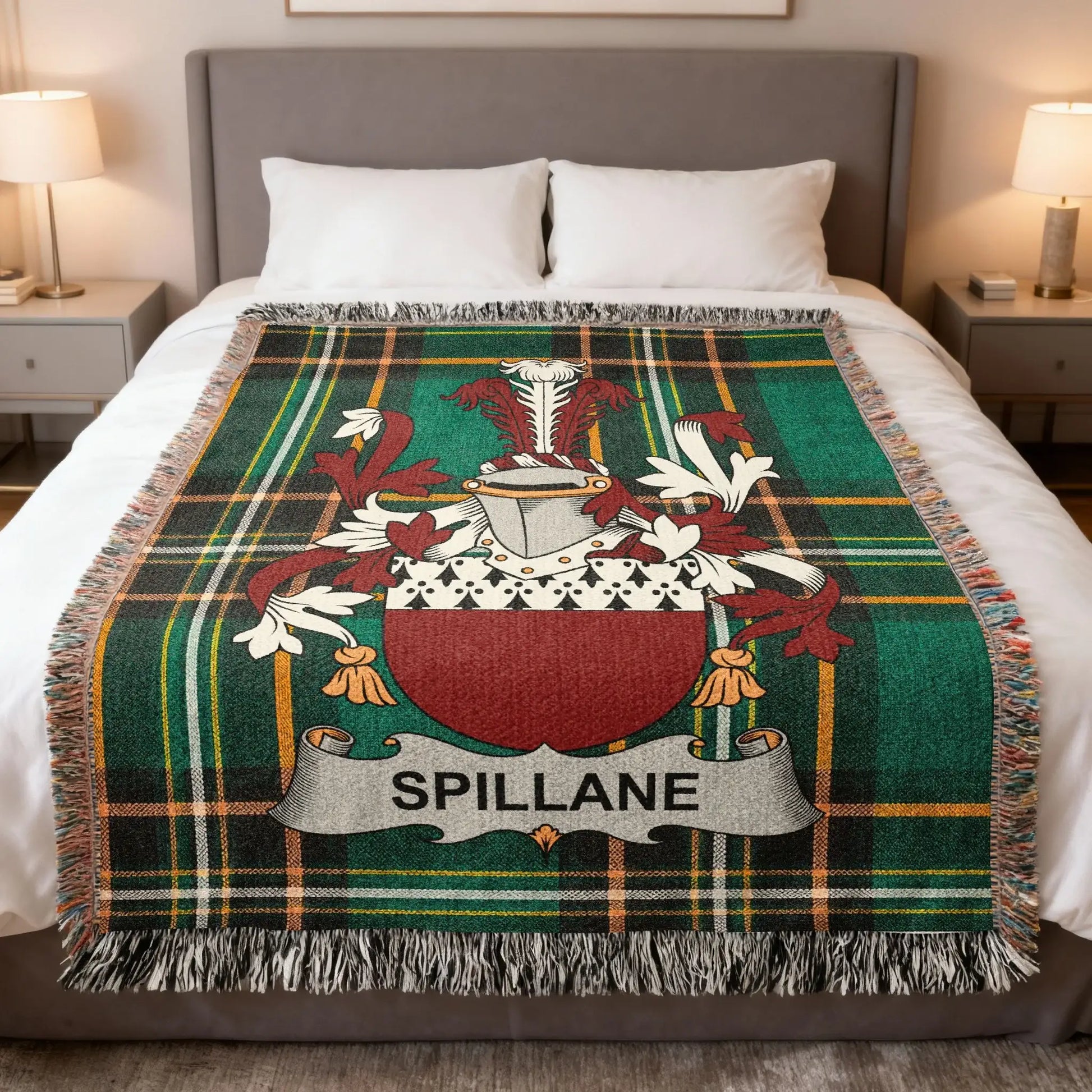 Tartan blanket with Spillane family crest on a bed.