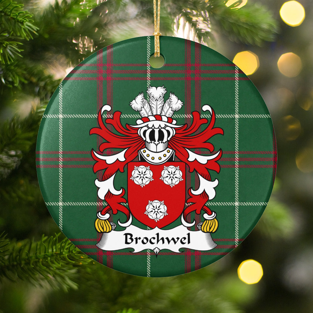 Brochwel Style 2 ornament hanging in a Christmas tree with warm lights; three white roses on a red shield on Welsh national tartan.