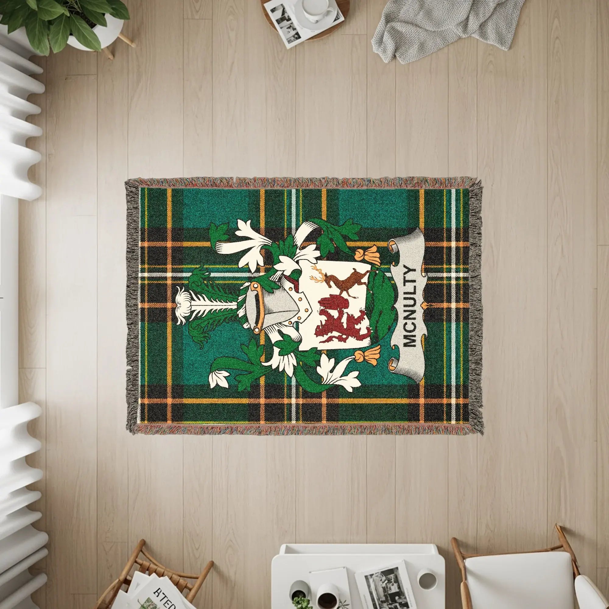 McNulty clan crest on green plaid woven blanket with fringe.