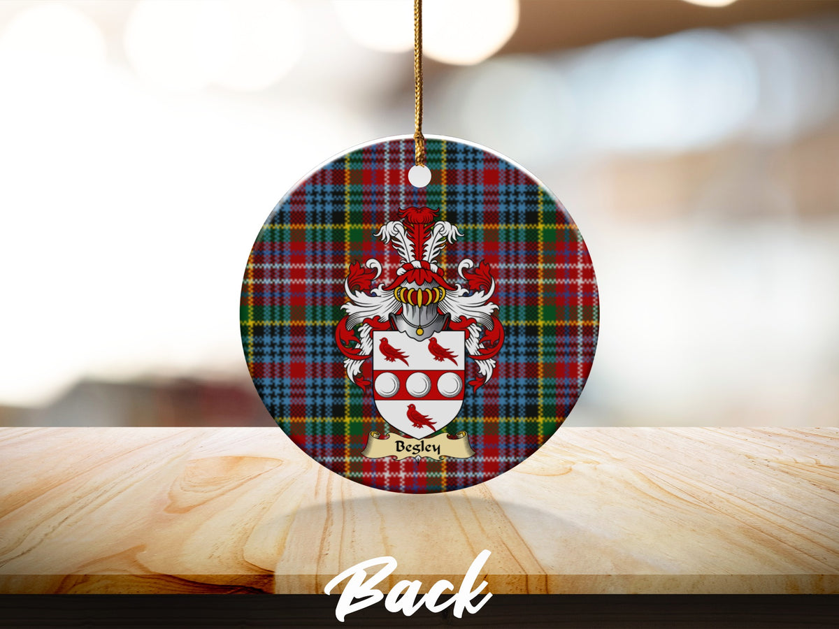 Round Begley Scottish clan ornament with family crest on a Caledonia tartan background