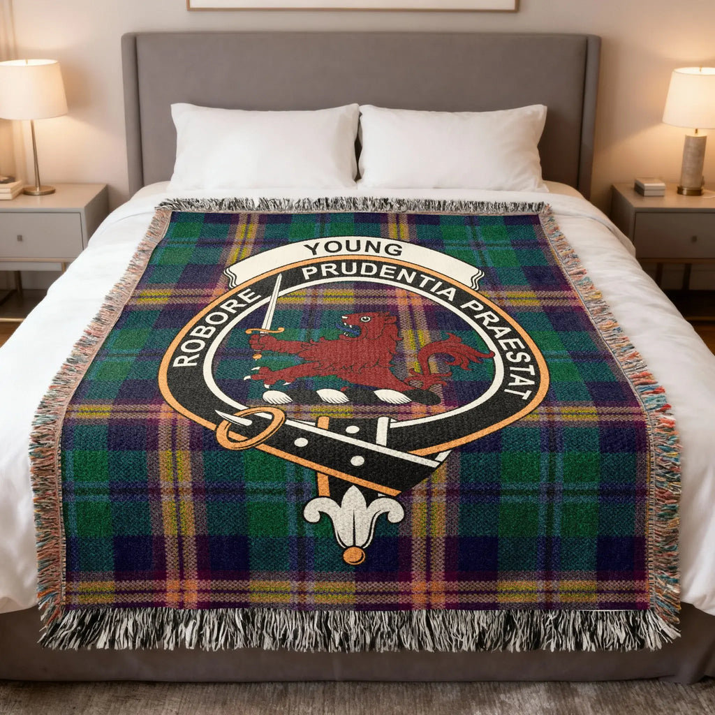 Young clan woven cotton blanket with crest on a tartan background