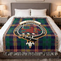 Young clan woven cotton blanket with crest on a tartan background