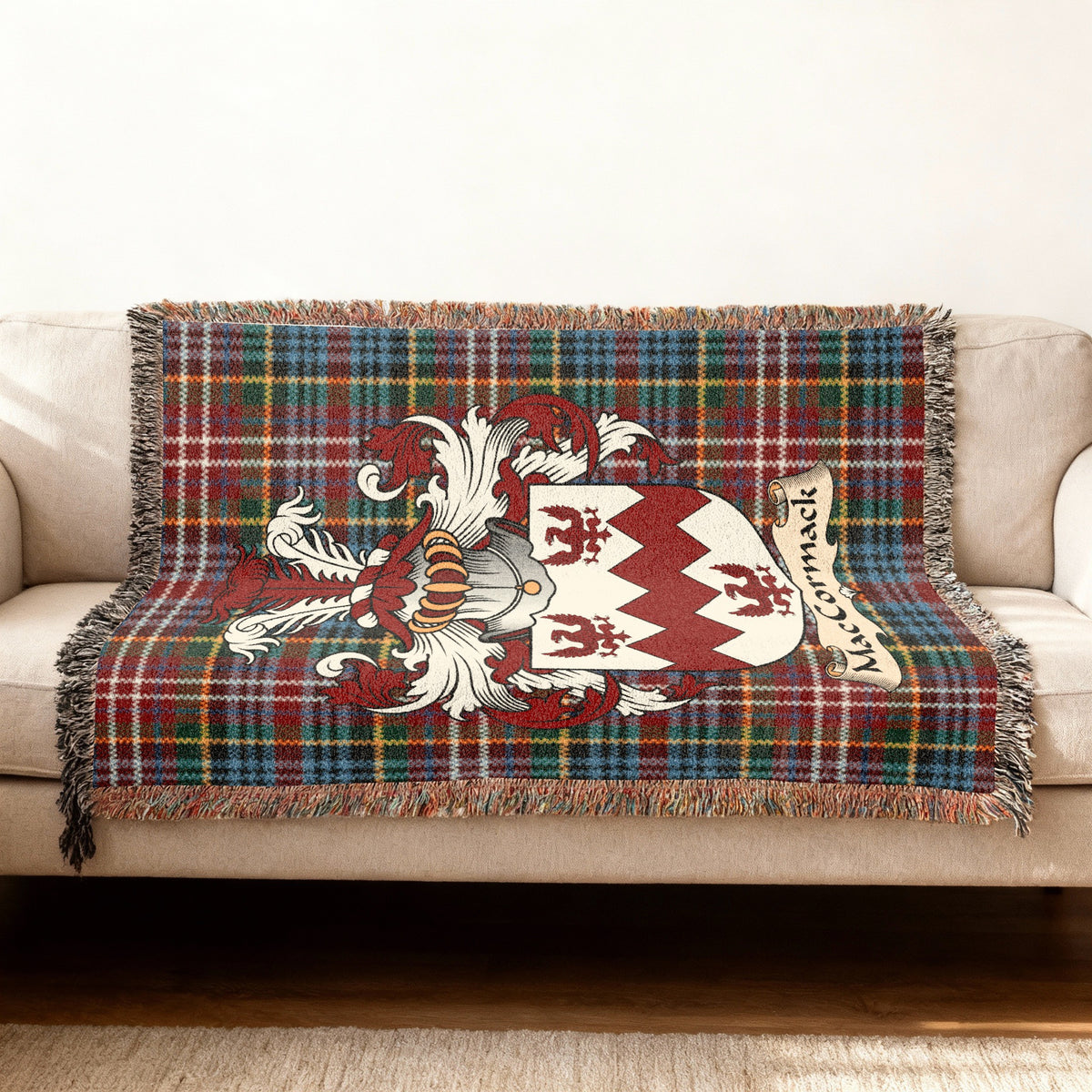 MacCormack Scottish woven blanket with family shield and Caledonia tartan background