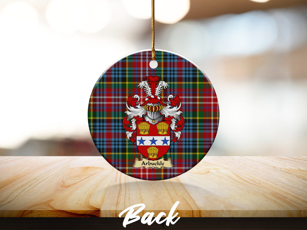 Round Arbuckle Scottish clan ornament with family crest on a Caledonia tartan background
