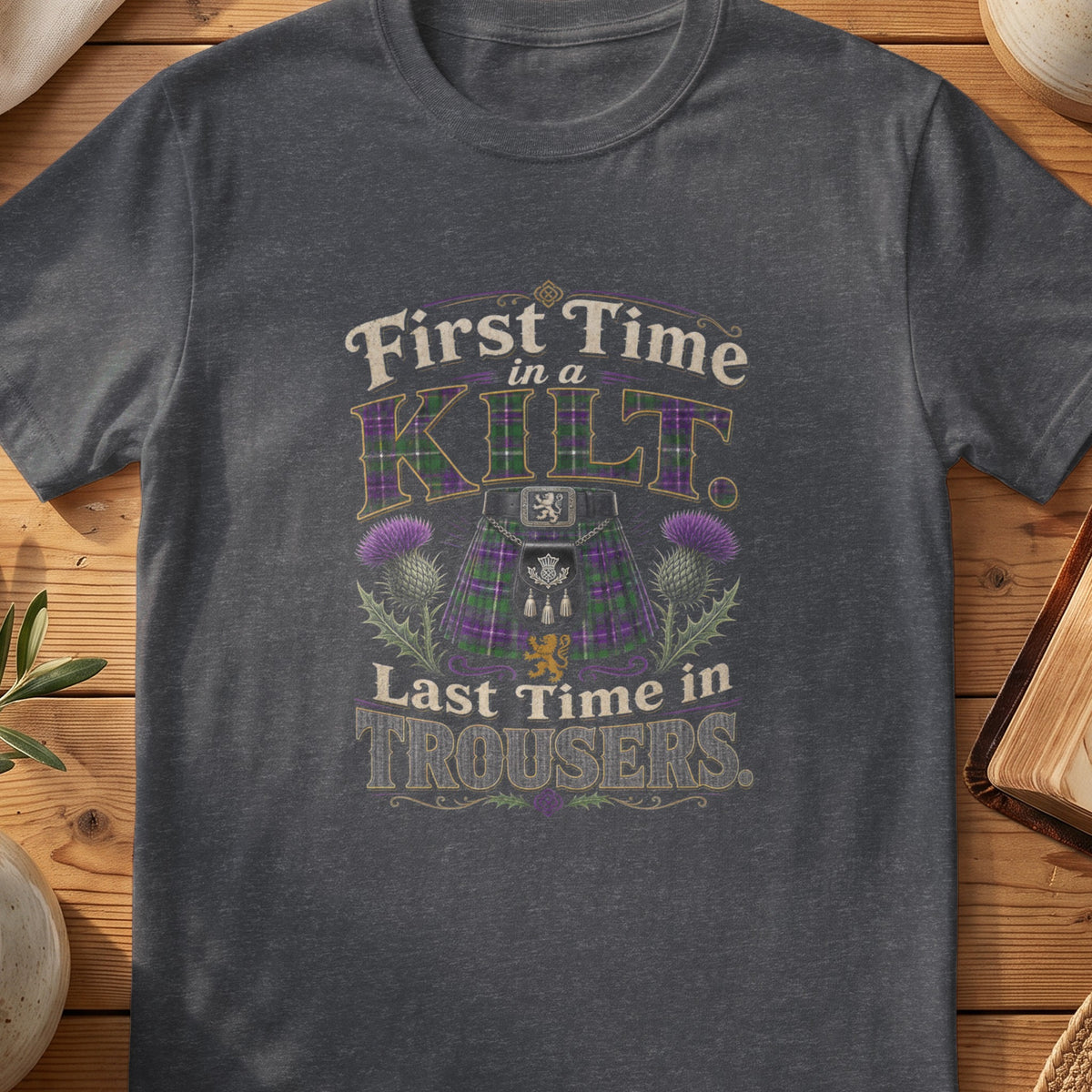 Dark grey Gildan 64000 unisex T-shirt flatlay with First Time in a Kilt Scottish graphic design