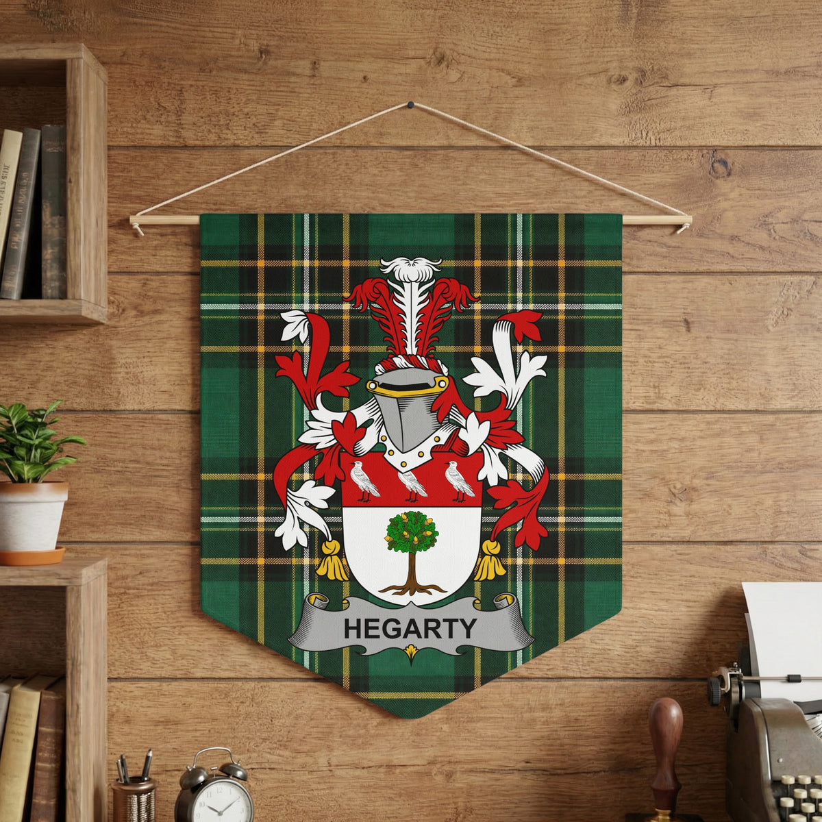 Hegarty family crest on a green plaid banner with a tree and birds.