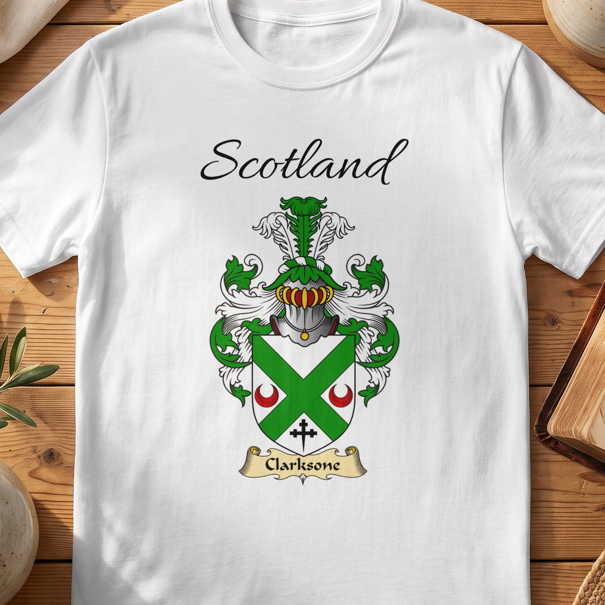 White Clarksone Scottish family shield T-shirt featuring a green diagonal cross between red crescents