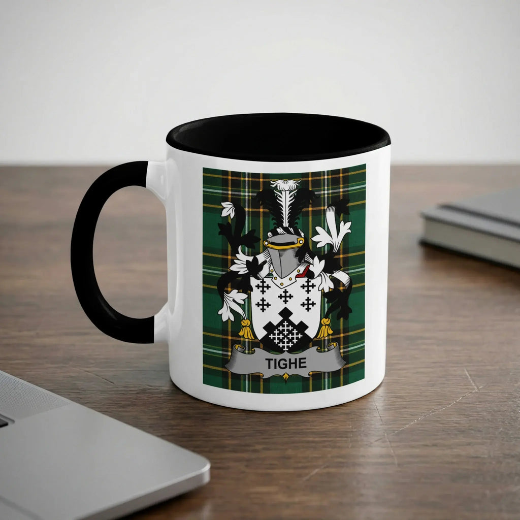 White mug with black handle featuring the Tighe family crest on a tartan background.