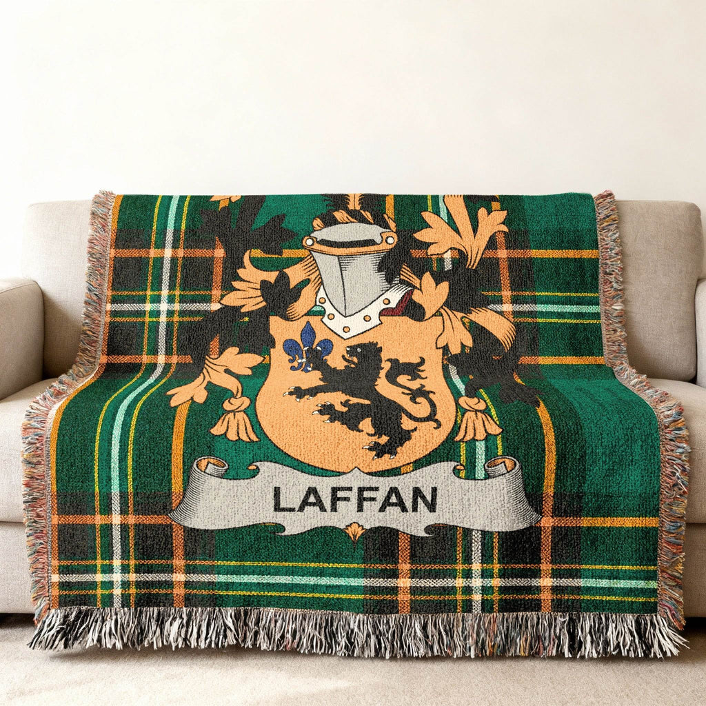 Green plaid throw blanket with the Laffan family crest.