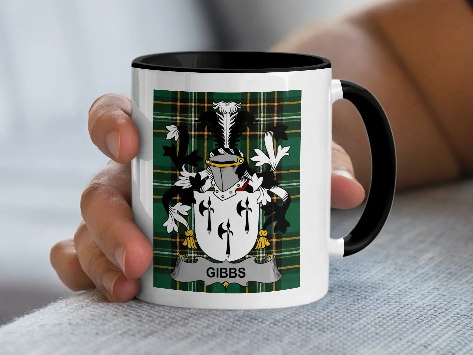 White mug with black rim featuring a green tartan crest with "GIBBS" text.