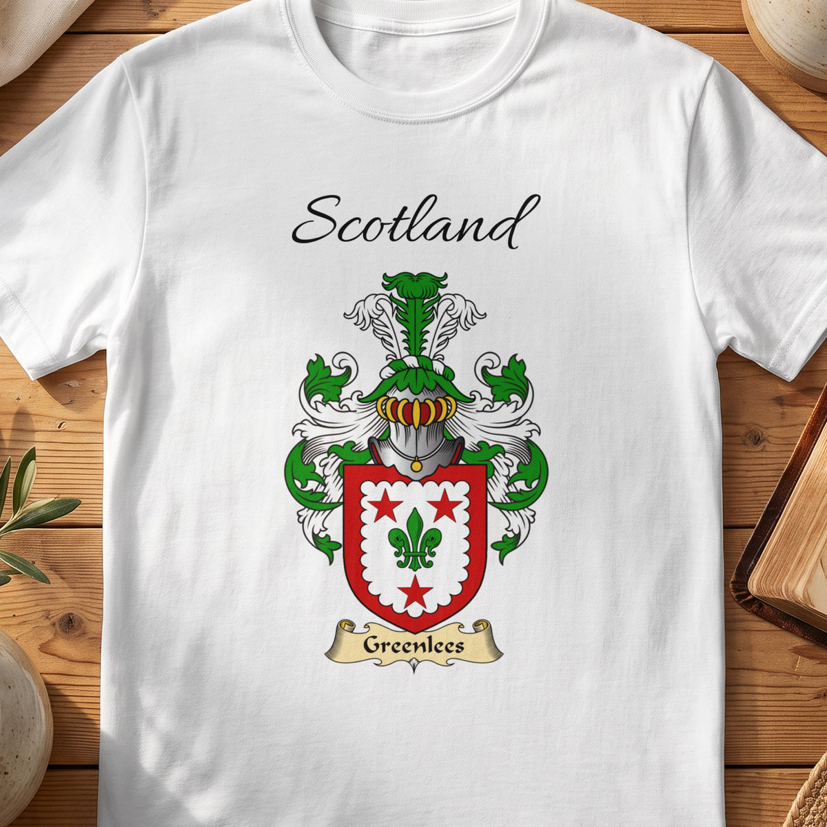White Greenlees Scottish family shield T-shirt featuring a green fleur-de-lis within a red border