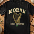 Moran Irish harp T-shirt in Black, with cream surname lettering, a gold-toned harp, green shamrock and “Irish Heritage” text.