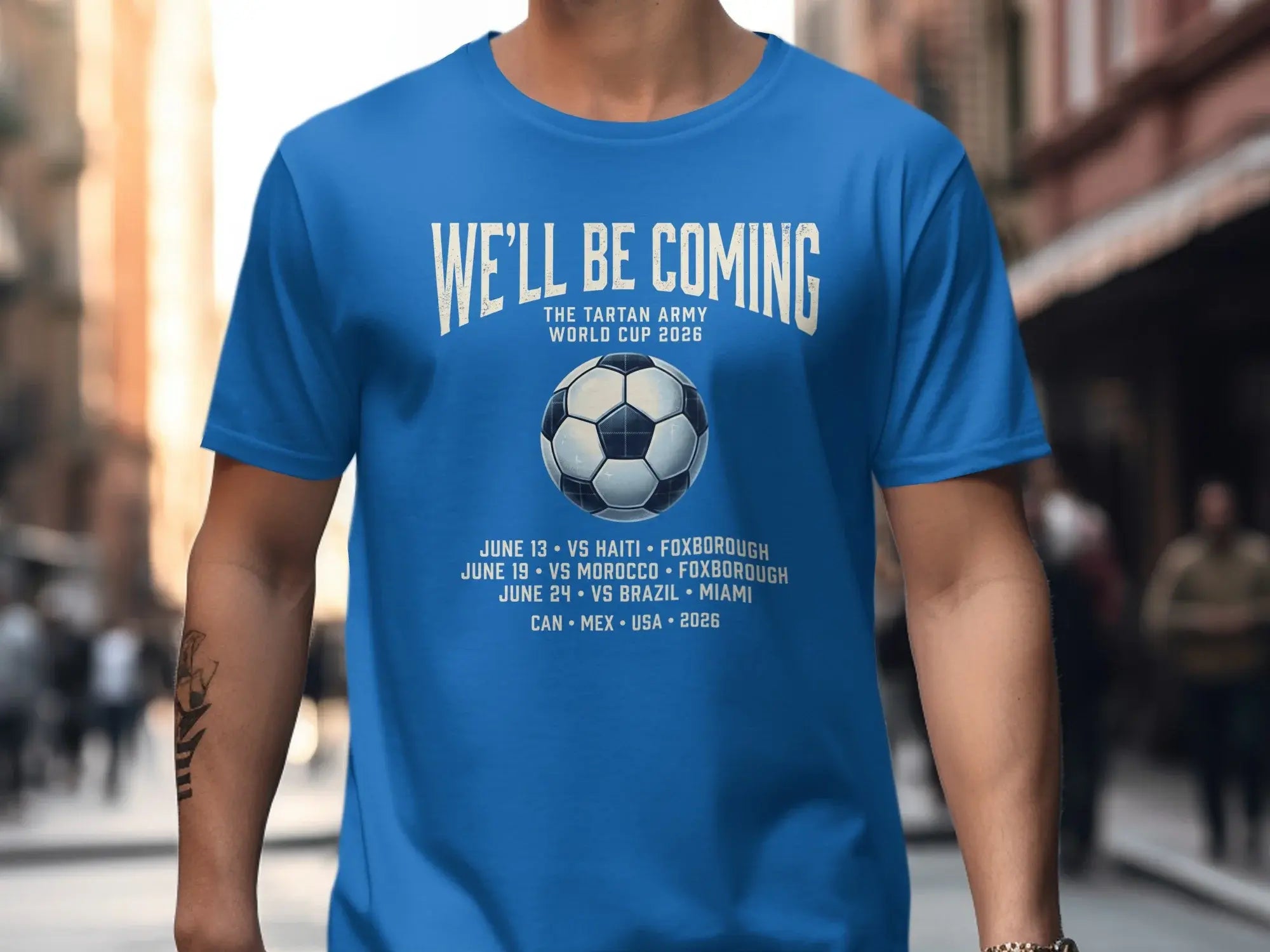 Blue t-shirt with soccer ball and World Cup 2026 schedule.