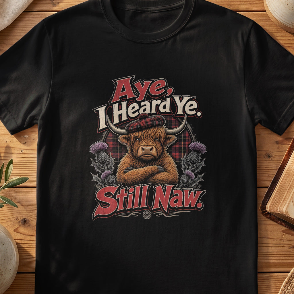 Black Gildan 64000 unisex T-shirt flatlay with Aye I Heard Ye Still Naw Scottish graphic design