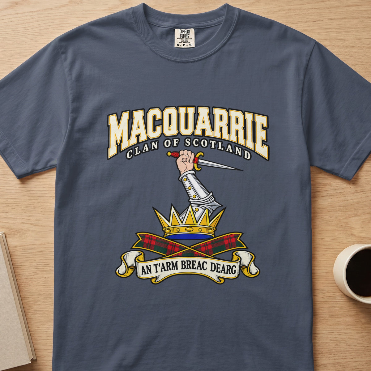 MacQuarrie clan T-shirt in slate blue, front view with armored arm holding a dagger above a crown