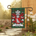 Howell family crest displayed on a green plaid garden flag.