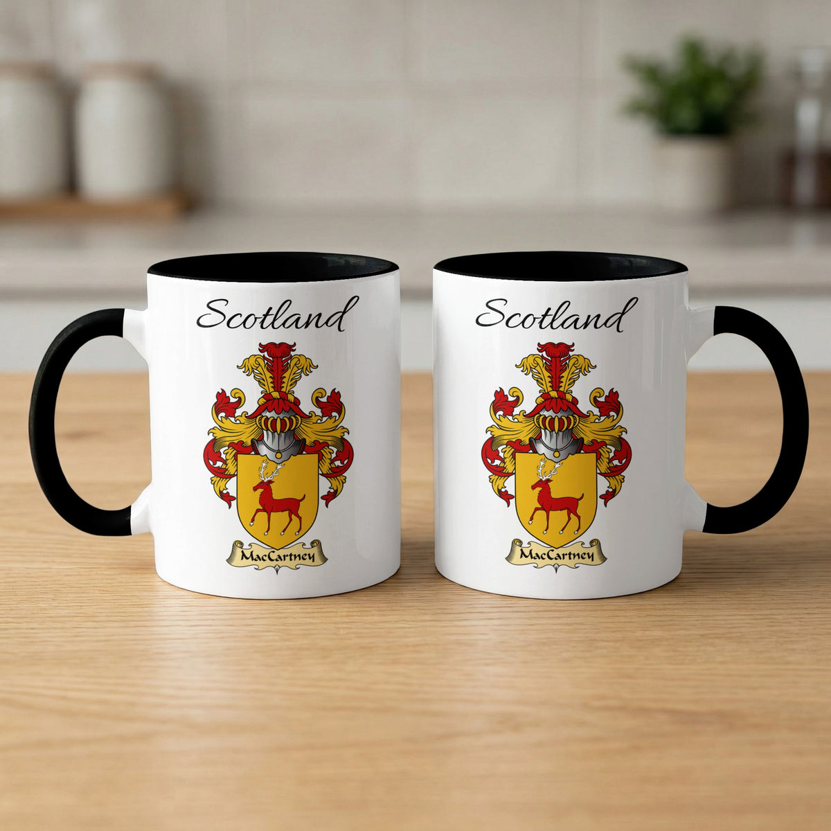 Pair of black-accent MacCartney Scottish coat of arms mugs showing the family design printed on both sides