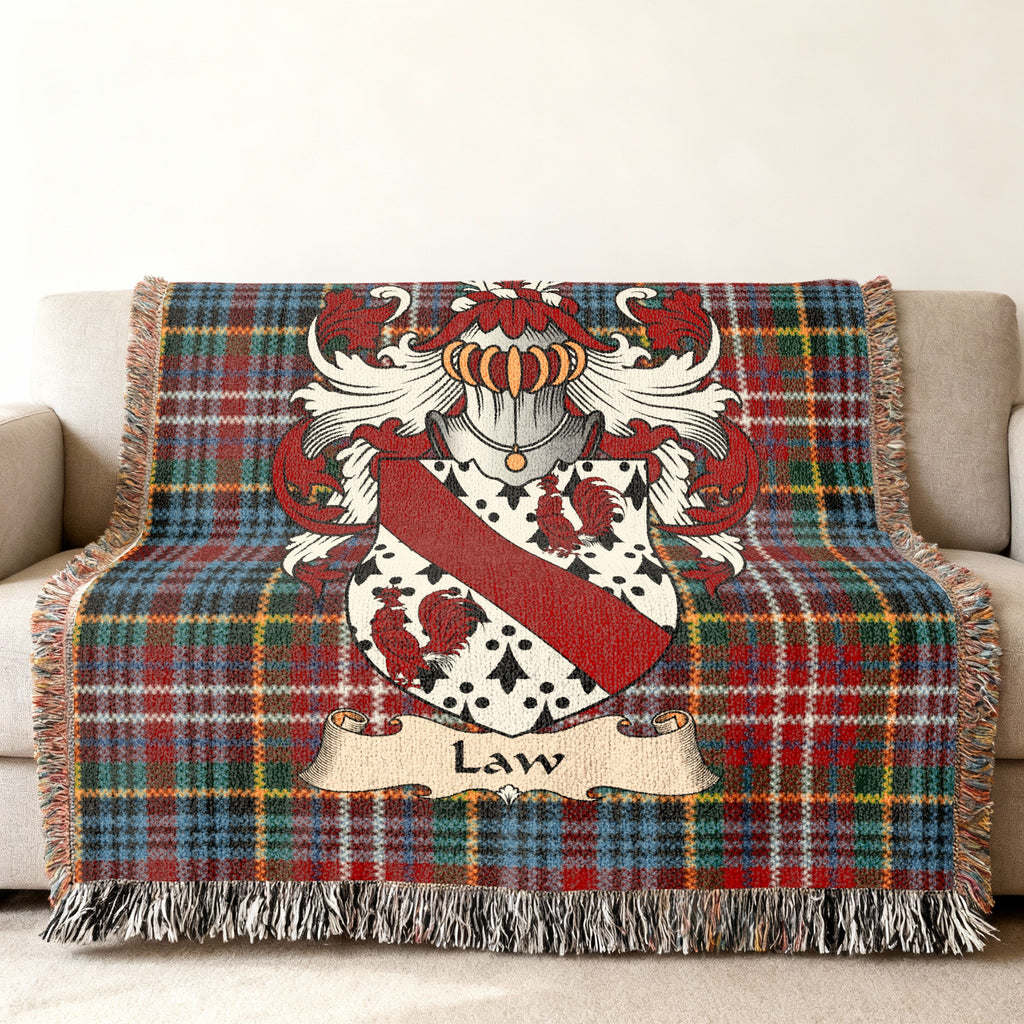 Law family crest emblem on a Caledonia tartan woven blanket