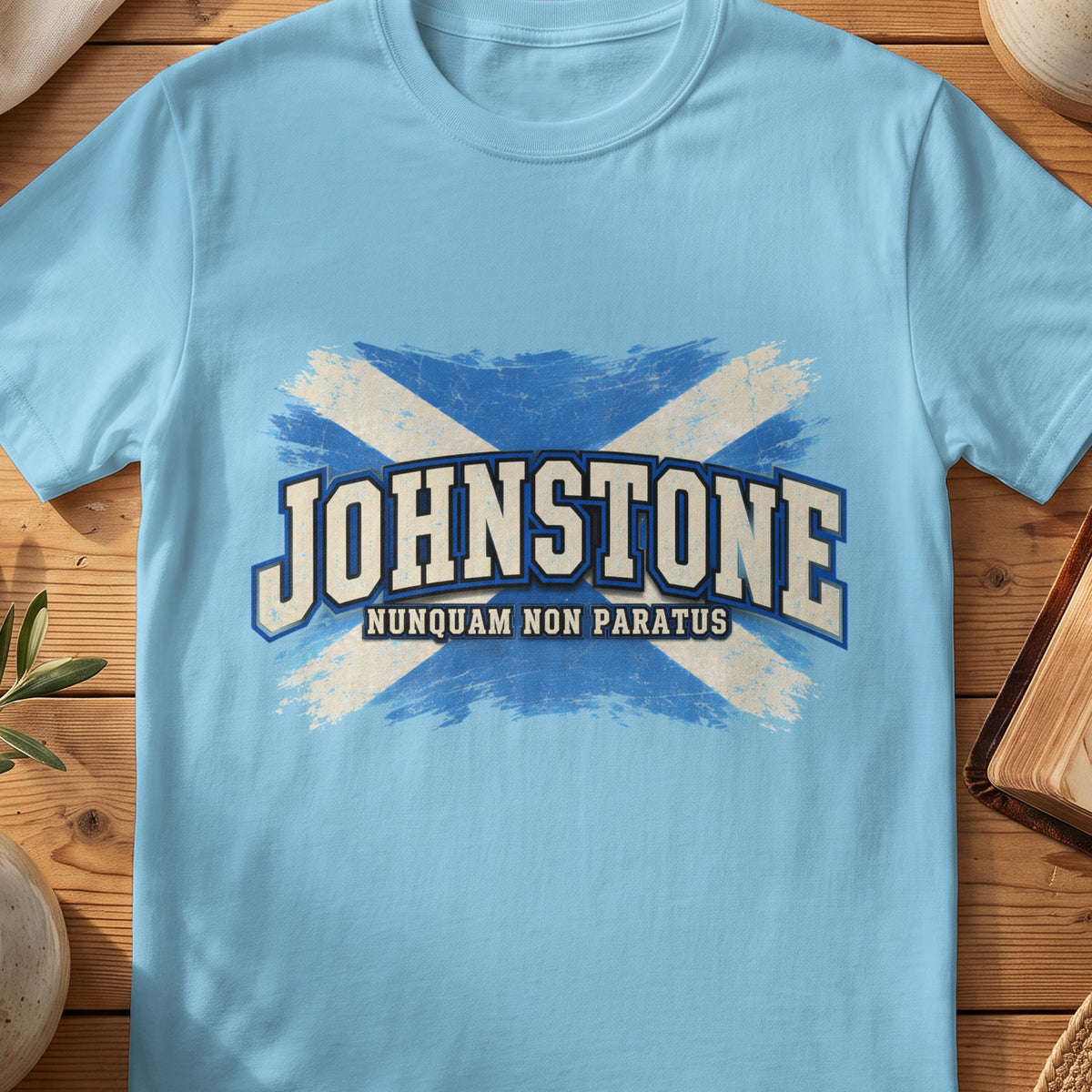 Johnstone Scottish Saltire T-shirt in Sky, with distressed blue and cream flag and “Nunquam Non Paratus” lettering.