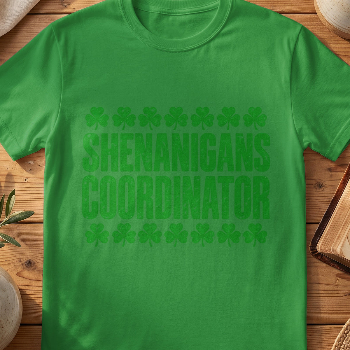Green funny Irish T-shirt with “Shenanigans Coordinator” text and shamrocks.