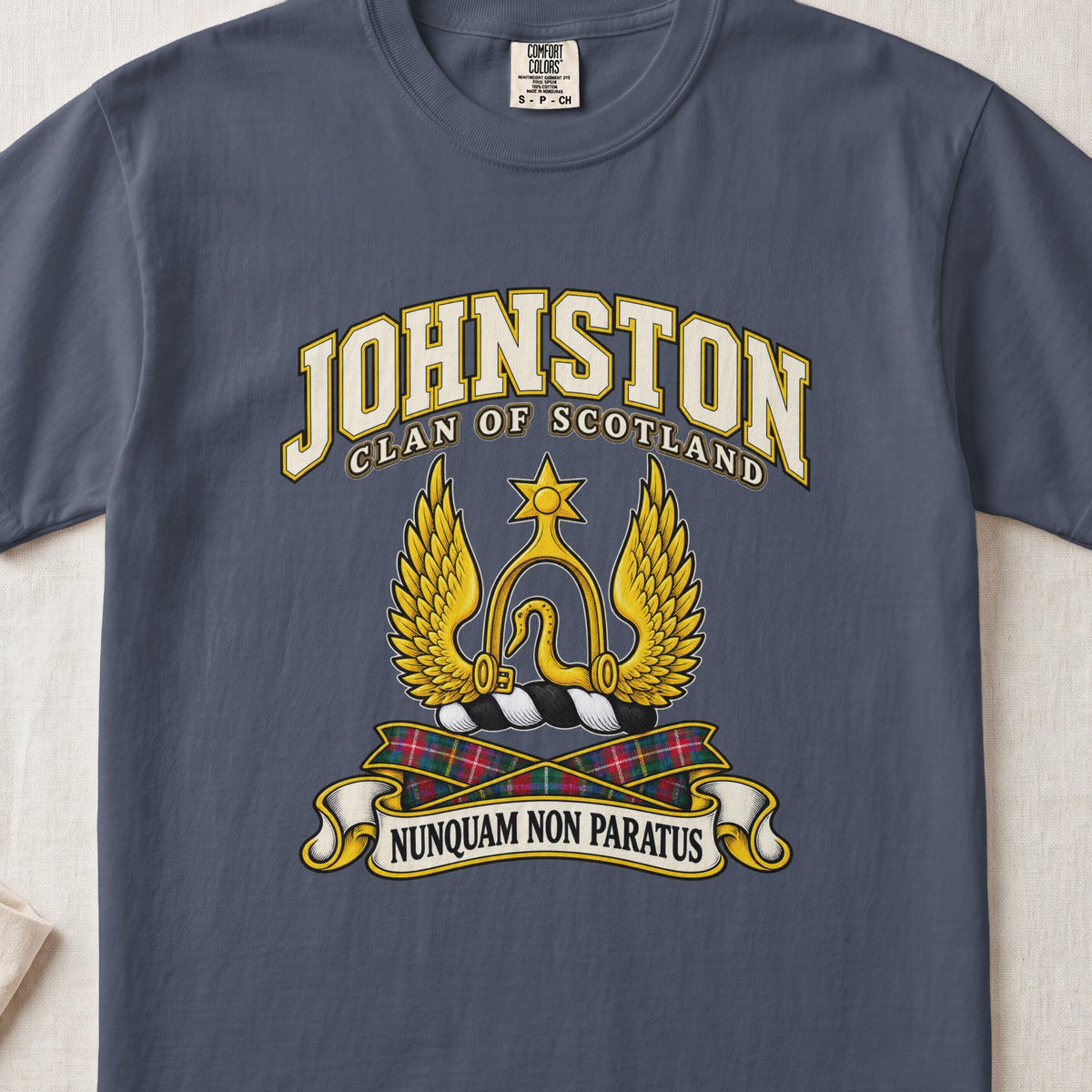 Johnston Scottish clan T-shirt in Midnight, front view with a golden winged emblem beneath a star and motto banner.