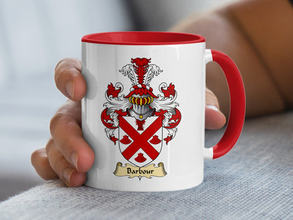 White mug with red handle, featuring the Barbour family crest.