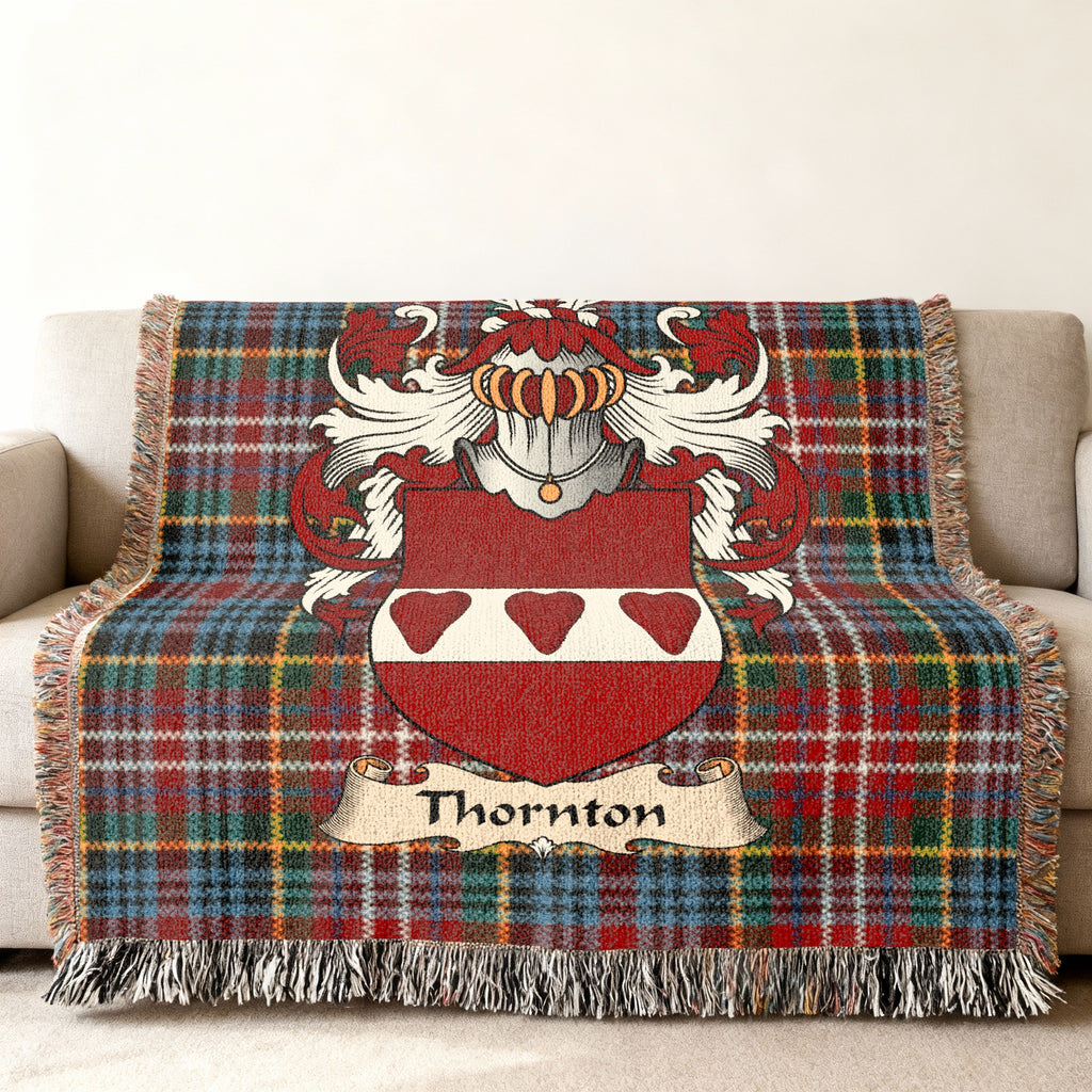 Thornton Scottish family shield woven blanket on a Caledonia tartan background