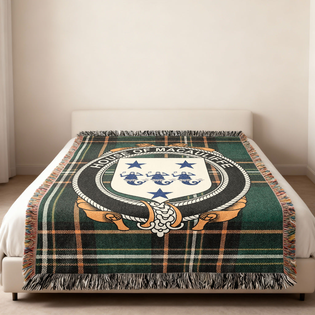 Macauliffe family crest emblem woven blanket displayed on a bed
