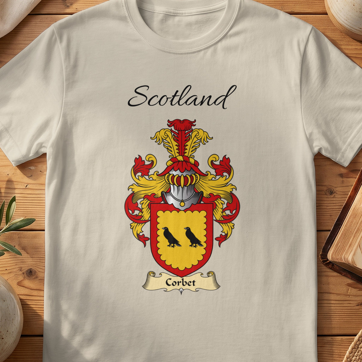 Sand Corbet Scottish family shield T-shirt featuring two black birds within a red border