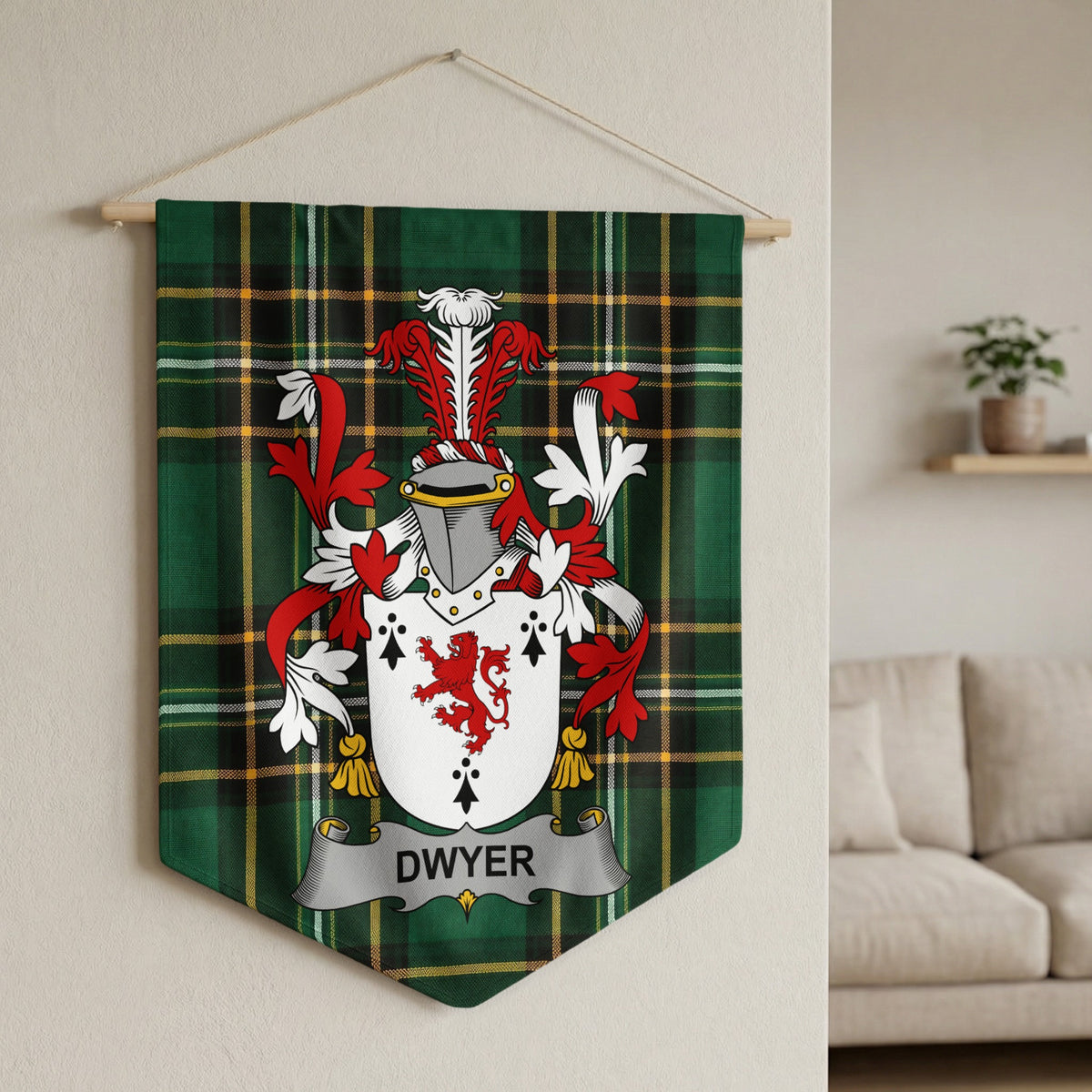 Dwyer family crest banner on green tartan fabric with silver scroll.
