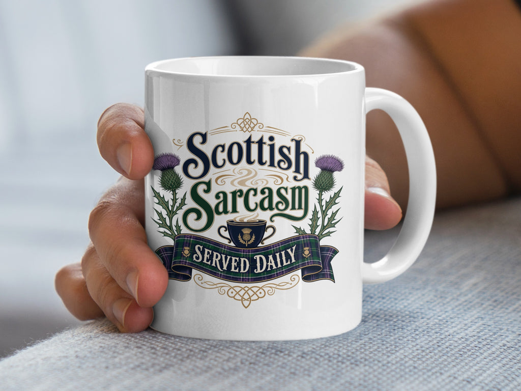 White mug with "Scottish Sarcasm Served Daily" text and thistle design.