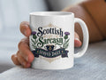 White mug with "Scottish Sarcasm Served Daily" text and thistle design.