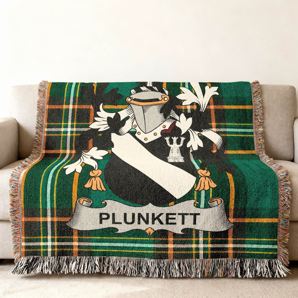 Green plaid throw blanket featuring the Plunkett family crest.